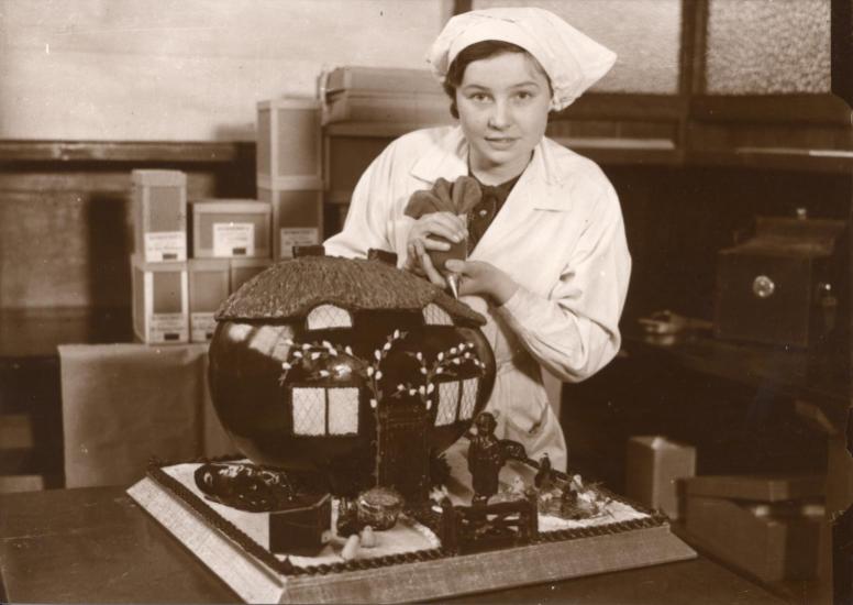 Photograph of a Rowntree & Co employee hand-decorating an Easter egg